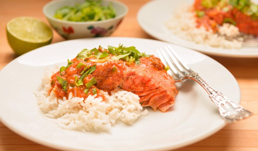 Pan-seared salmon fillet finished with light Indian spices and a touch of butter, served at Mystic India Panama