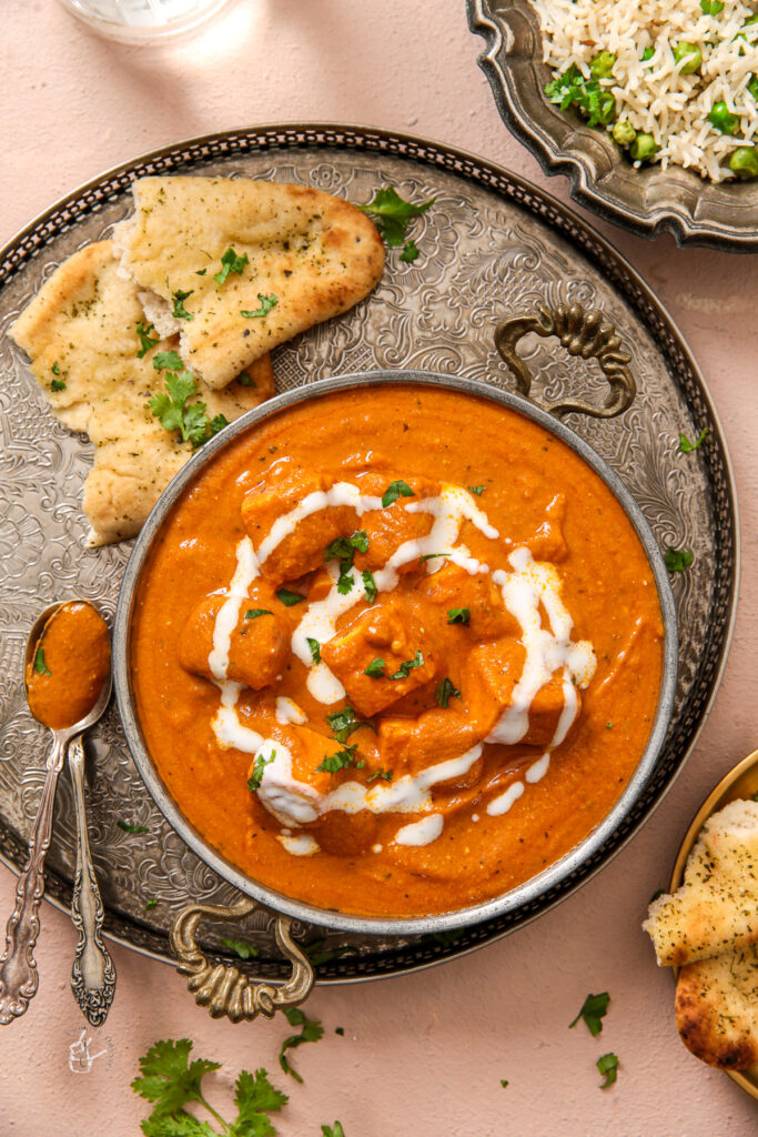 Paneer Makhanwala served in rich tomato butter gravy with aromatic spices.