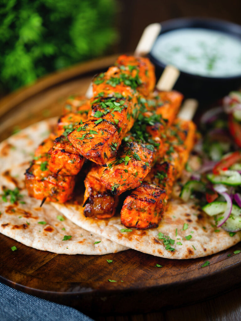 Salmon tikka grilled with Indian spices and smoky char at Mystic India Panama.