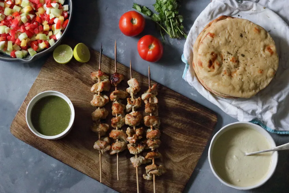 Garlic-infused chicken laksooni tikka grilled and served at Mystic India Panama.
