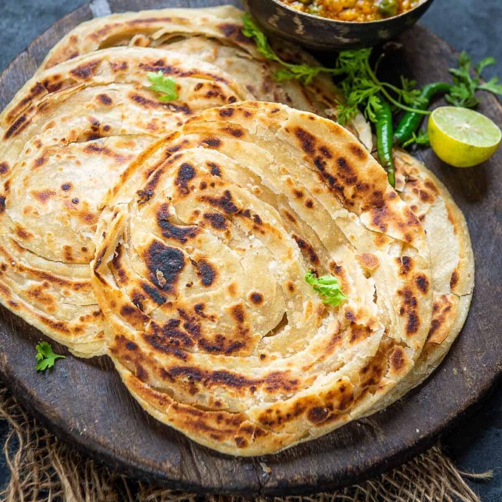 Laccha paratha showing golden flaky layers cooked in Indian style.