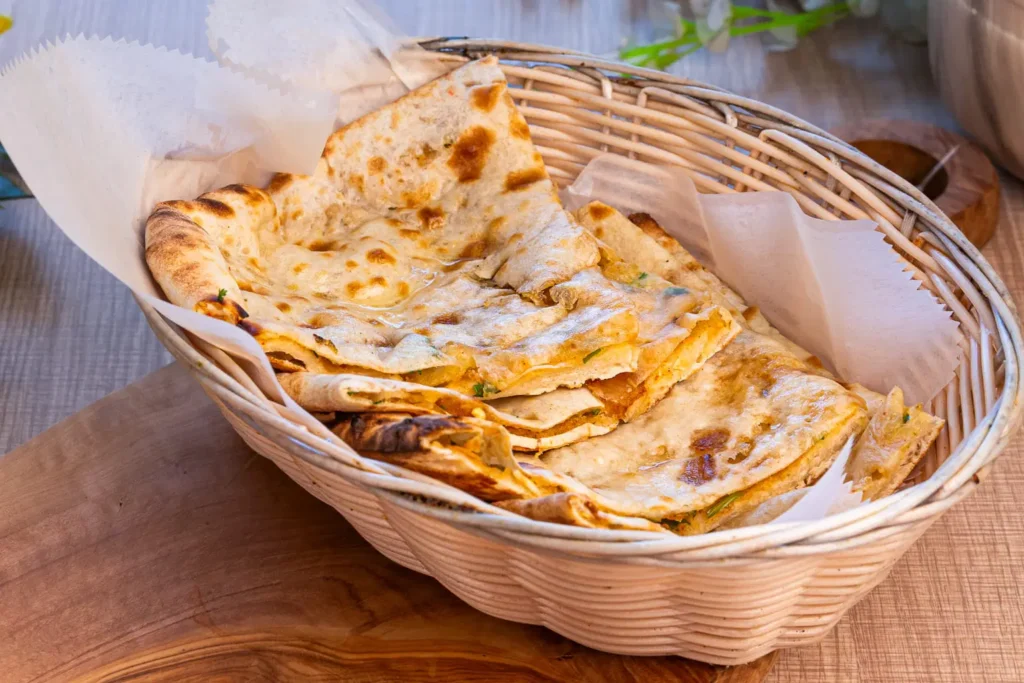Fresh onion kulcha served warm at Mystic India Panama.