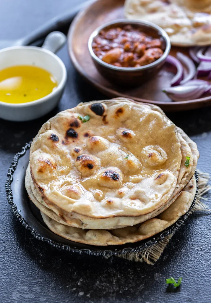 Freshly baked tandoori roti served with Indian curries at Mystic India Panama.